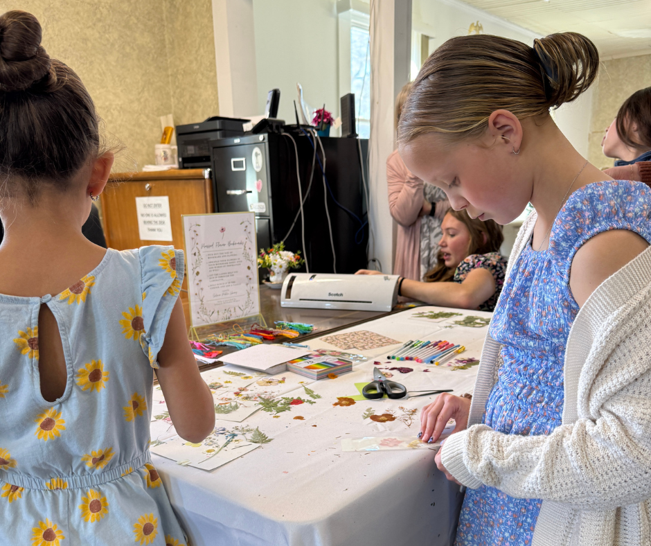 Bloom Together event, Gracyn Turner making a bookmark.