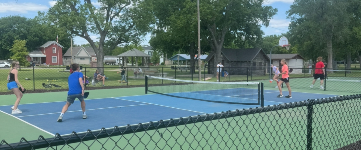 students_playing_pickle_ball_on_the_new_court